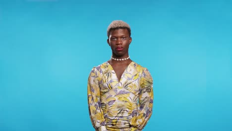 transgender man looking at camera with a serious face.