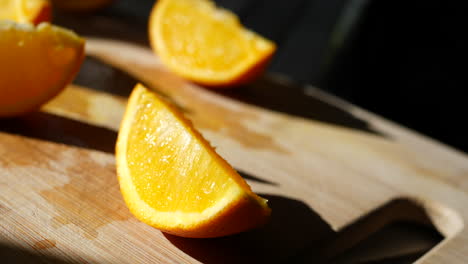 orange fruit slices on a cutting board in the sunlight for a healthy snack