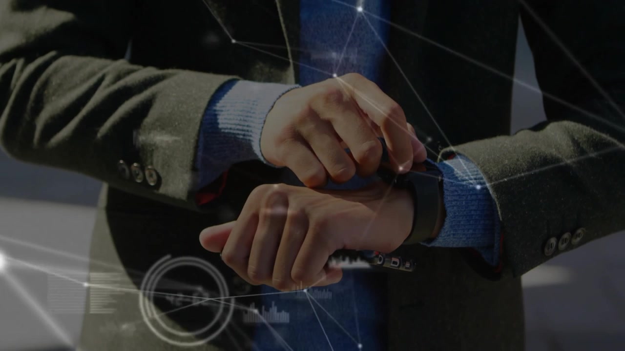 Man raising wrist tapping smartwatch syncing data then grabbing phone swiping technology charts