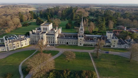 magical aerial view of sunset over ashridge house, surrounded by ornamental gardens, hertfordshire, uk