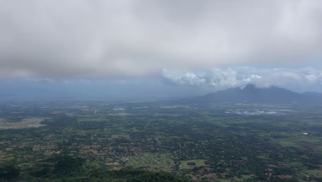 Cinematic-drone-hyperlapse-of-clouds-moving-over-the-land-in-the-Philippines,-Aerial,-Timelapse