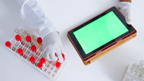 Green-screen-tablet,-science-and-hands-with-blood