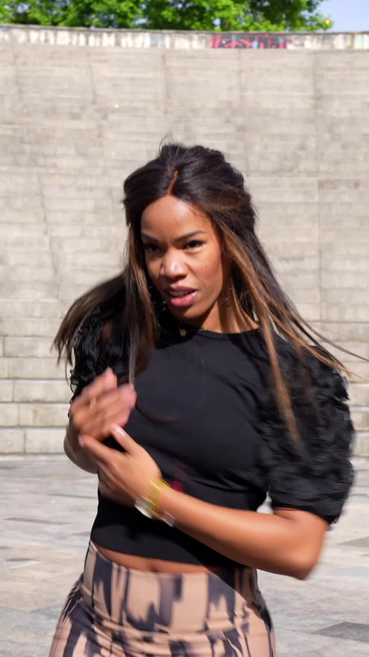 A woman performing contemporary dance outdoors