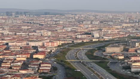 aerial view of a city with highways and residential buildings