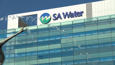 editorial footage of the sa water building with a water feature in the foreground. this video is perfect for projects about water conservation, infrastructure, and utilities.
