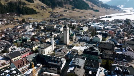 aerial view of the alpine town of san candido in italy.