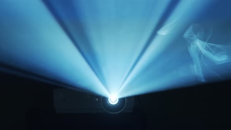 projector beam shines through fog