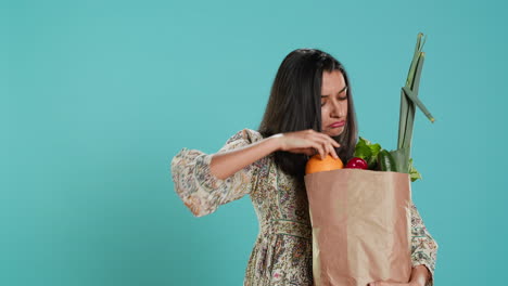 Person-inspecting-groceries-after-buying-them-from-zero-waste-shop