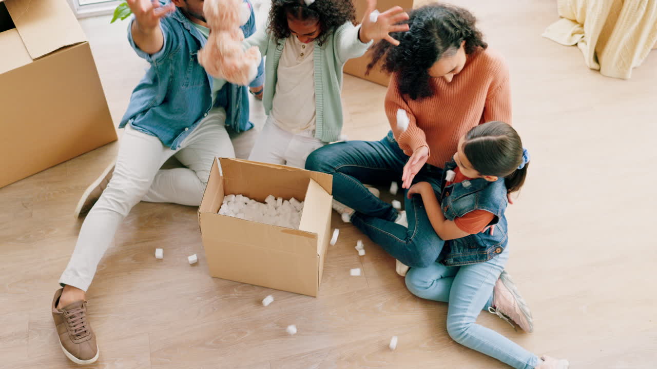 Happy family, unboxing and real estate in new home