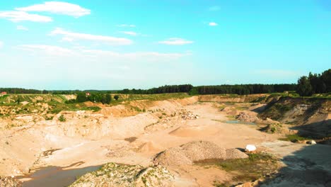 aerial dolly shot of dunes and pits in a quarry