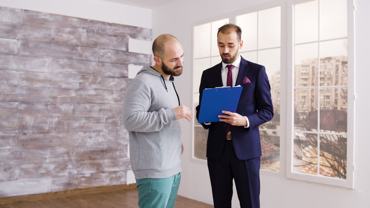 Real Estate Agent Showing Property to a Client