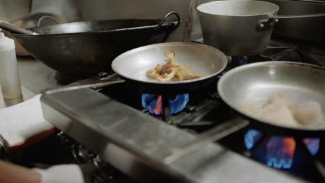 a chef cooks mushrooms in a kitchen