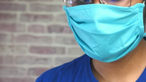 person wearing a blue mask