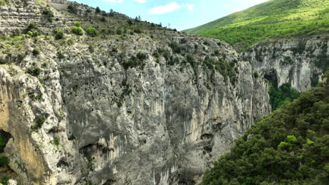 steep rock climbing wall of verdon gorge in the provence aerial