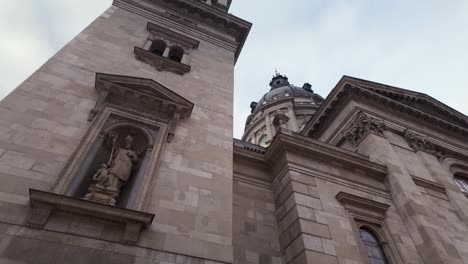 tilt up to st augustine statue in facade niche at st stephens basilica