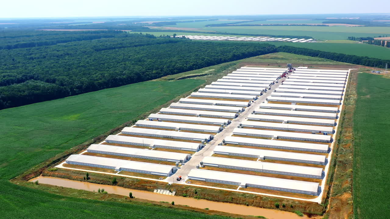Modern agriculture plant fields farm buildings. Agricultural farming buildings aerial view.