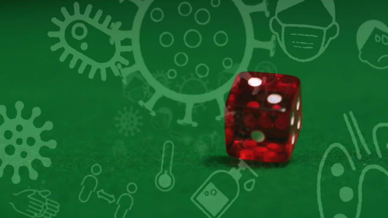 animación de células e iconos de covid-19 sobre dos dados en un fondo verde