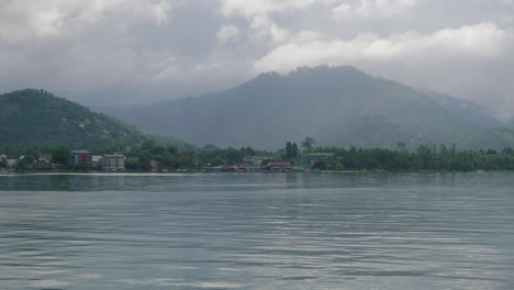 koh samui thailand on overcast cloudy day view from ocean looking land bound