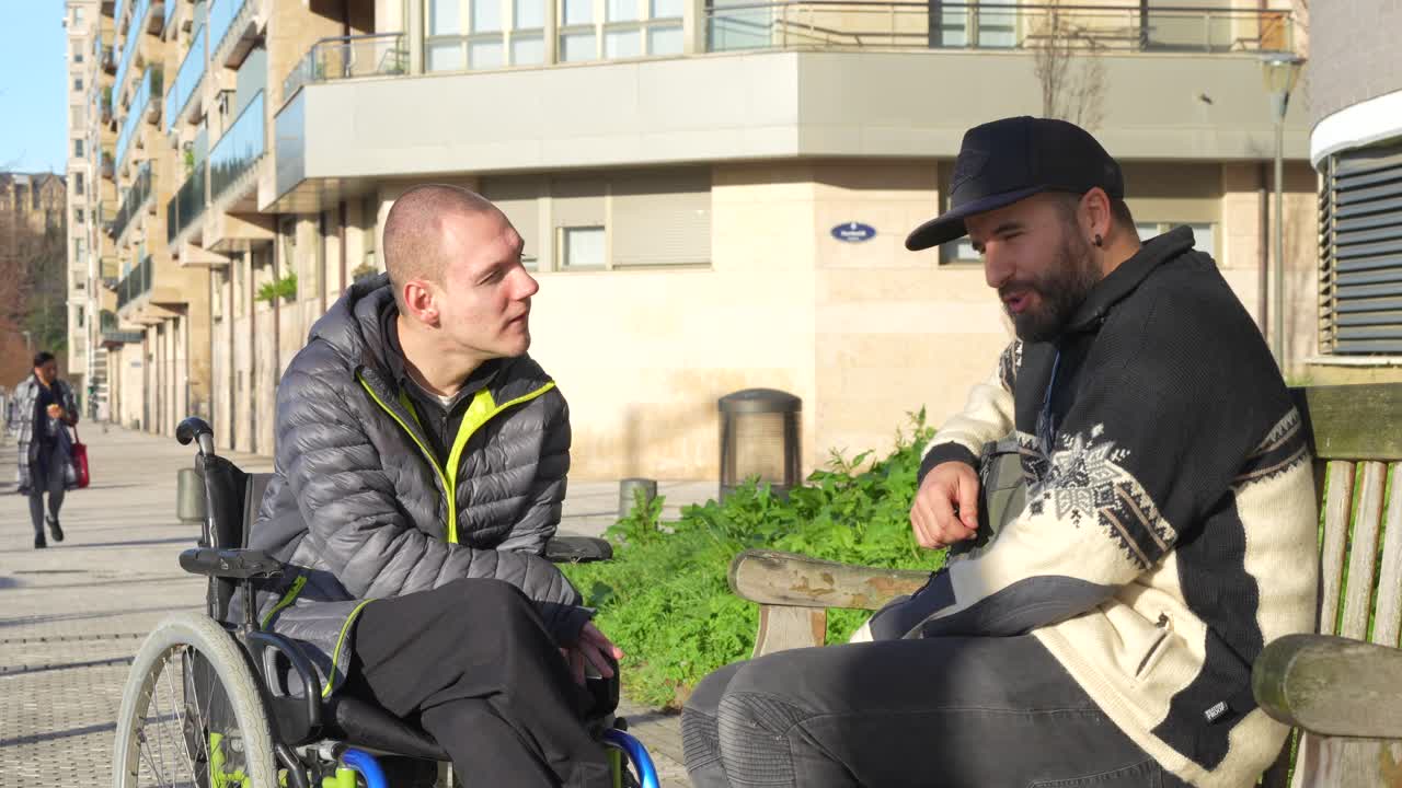 Two Men Engaging in a Friendly Conversation in an Urban Setting