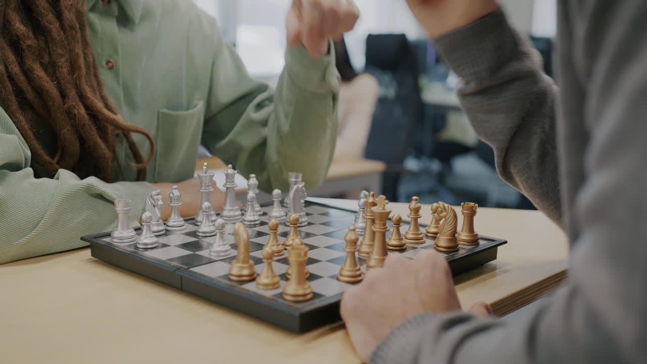 People Playing Chess in an Office