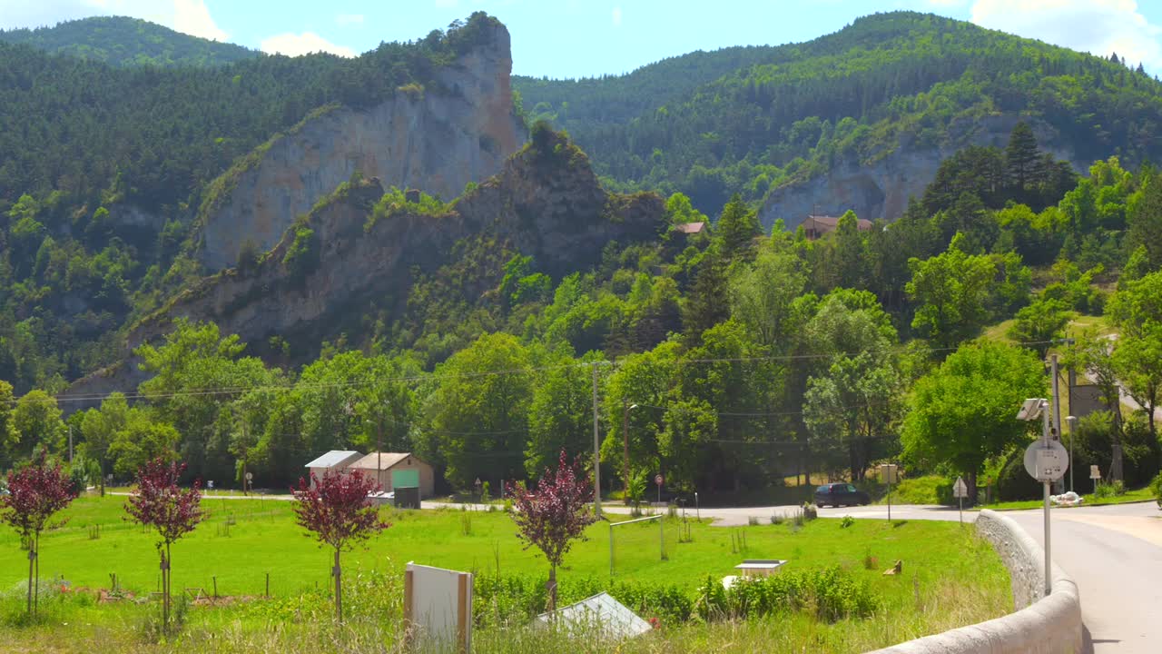 Picturesque view of mountains with green vegetation and lush greenery foliage in France. Daytime