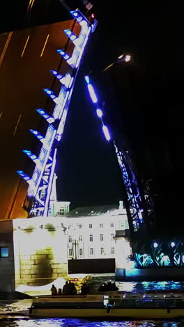 night view of a lifting bridge in st. petersburg