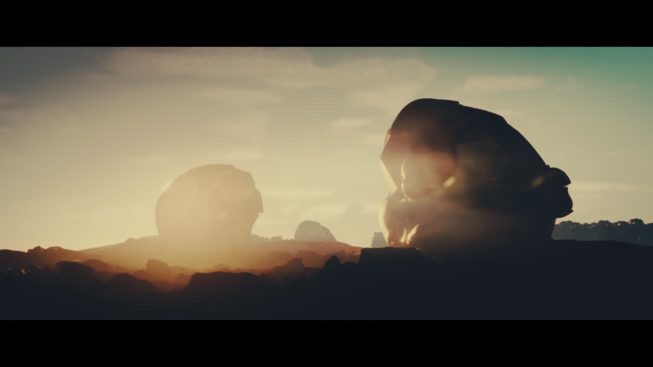 Huge golden statues in the desert during sunset