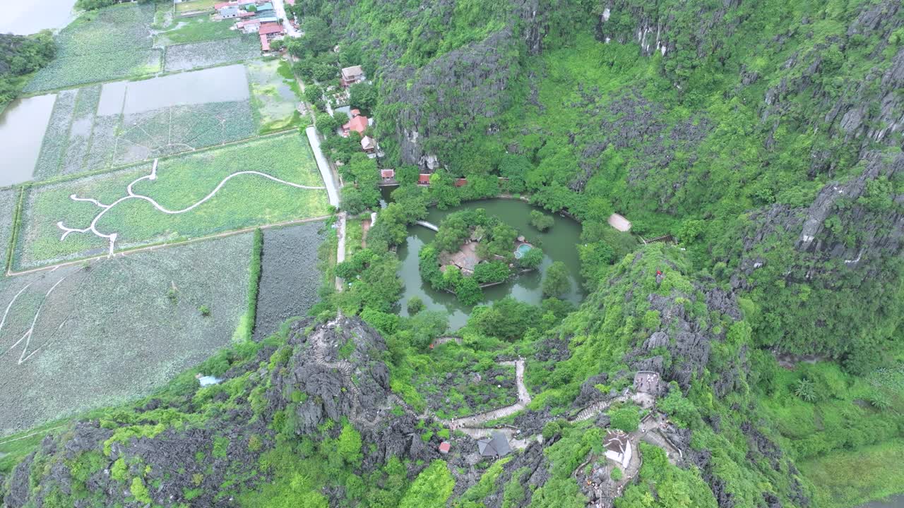 Lush green valley and lake in ninh binh, vietnam, peaceful and remote, aerial view