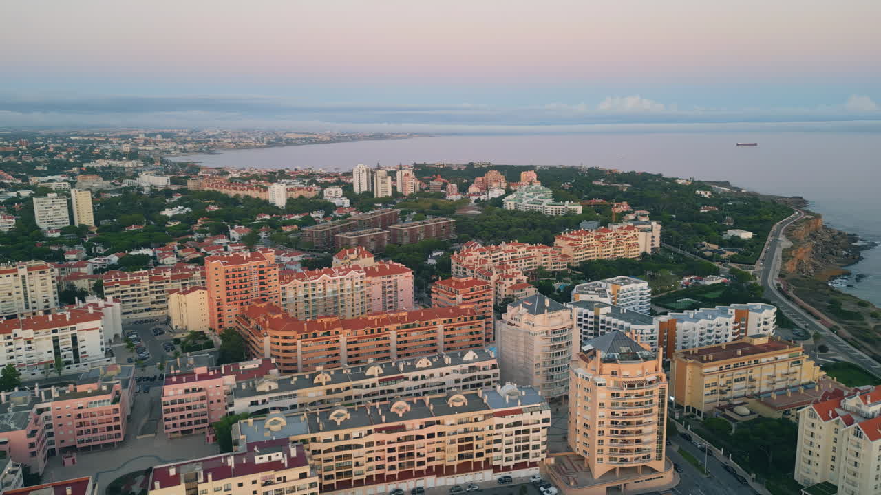 Evening scenery coastal town aerial view. Buildings on picturesque waterfront
