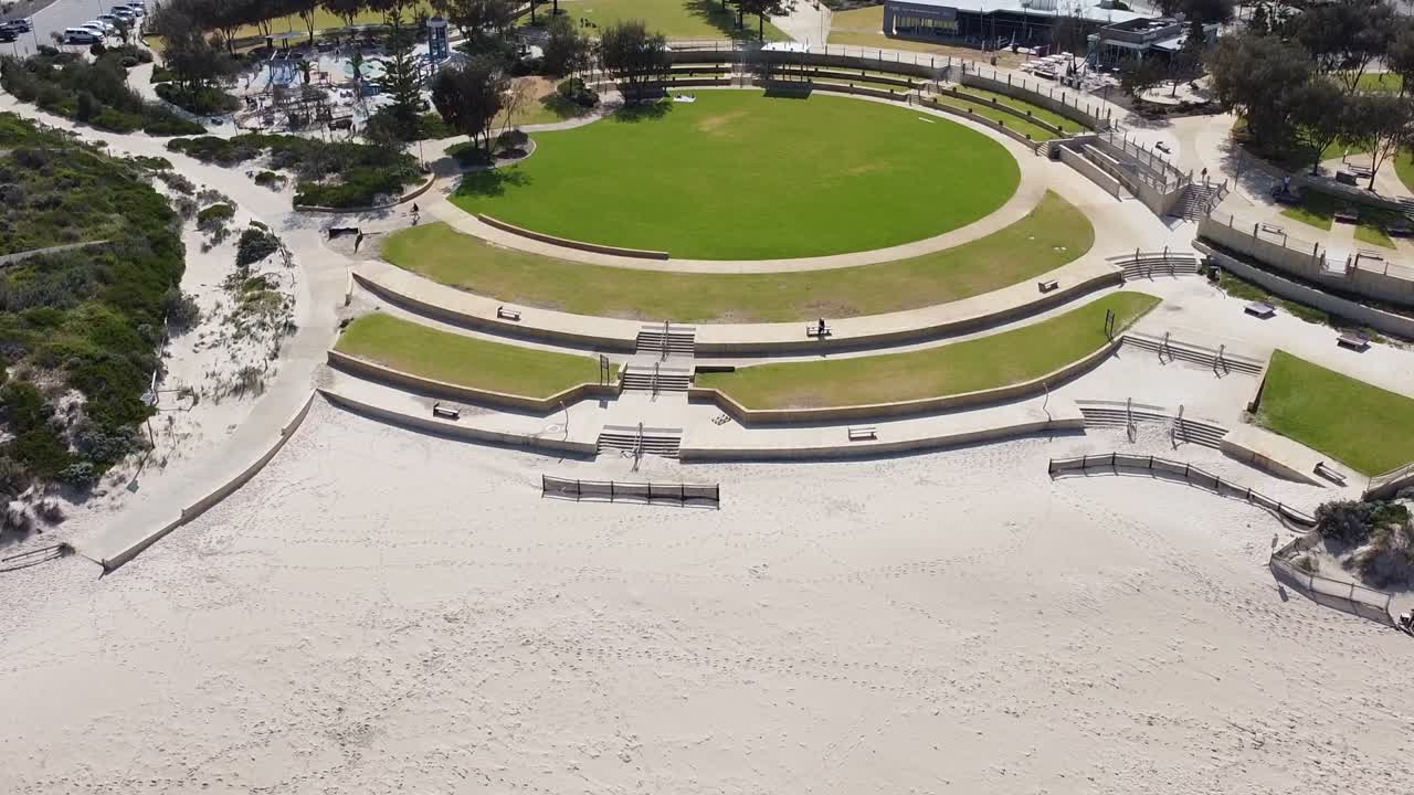 Tilt up aerial view of Shorehaven beach to reveal housing development in background