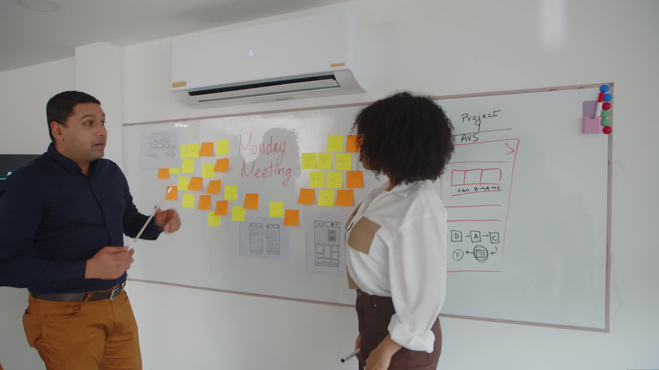 Product Manager and Developer Discussing Features of App