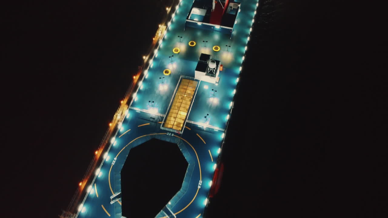 Aerial drone view of a yacht at night in Liverpool, England