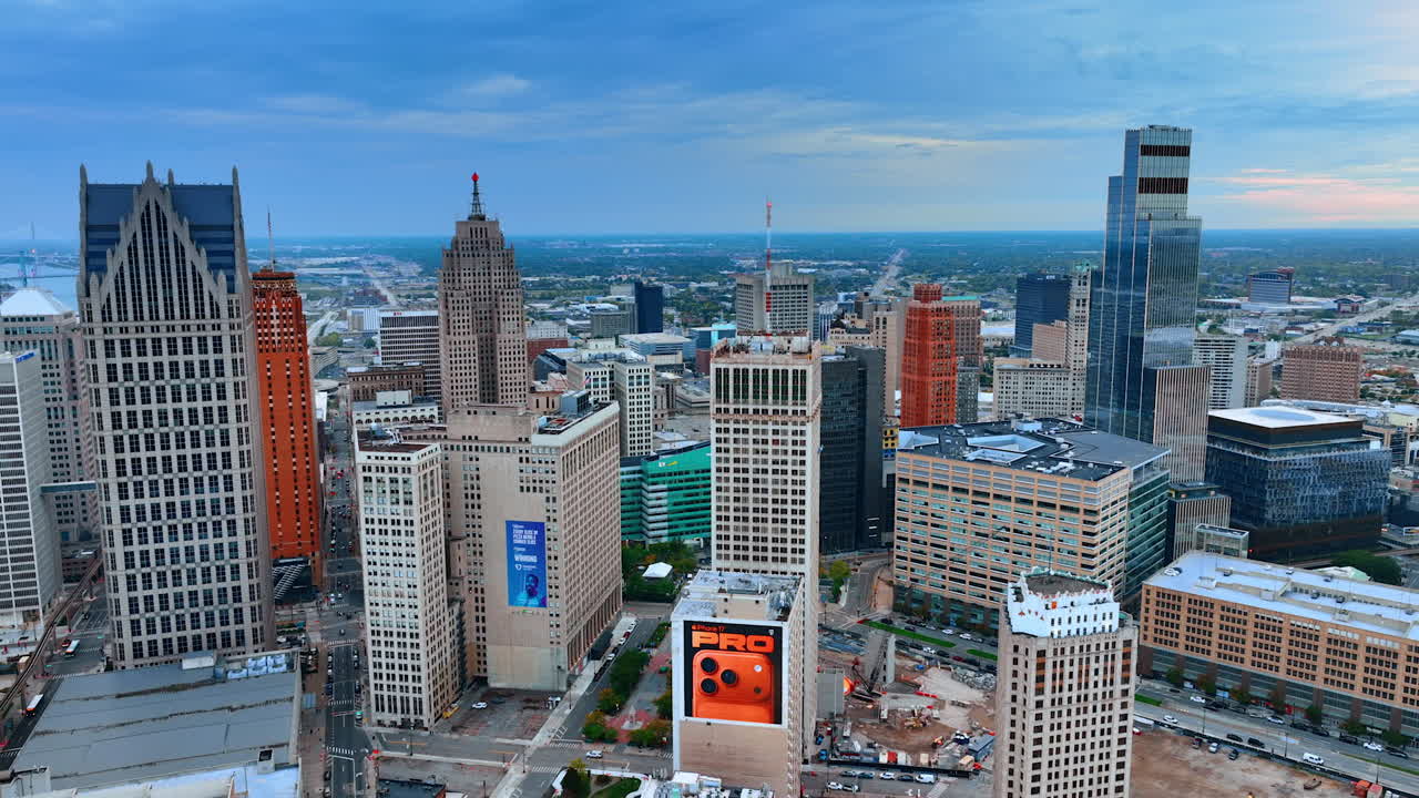 Detroit, USA, 28 July 2025: Detroit skyline with river backdrop. City towers rise over the wide river in soft evening light