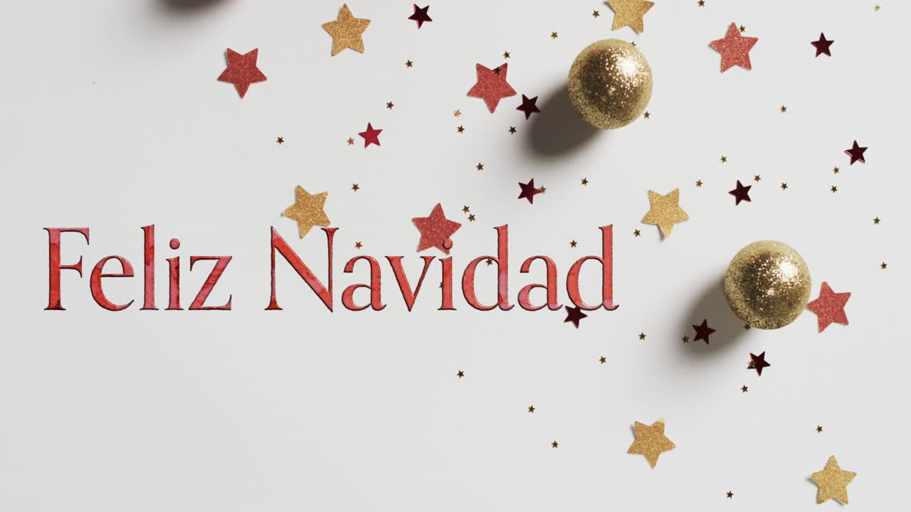 feliz navidad texto en rojo sobre estrellas y bolas de navidad en fondo blanco