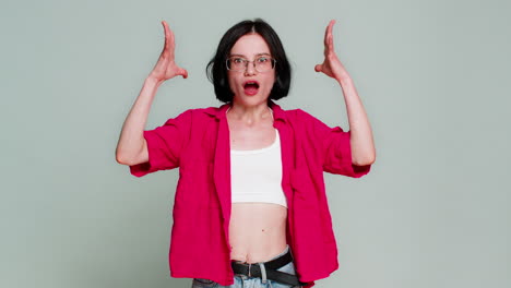 woman theatrically rolls eyes and spreads arms expressing mind blown reaction to shocking challenge