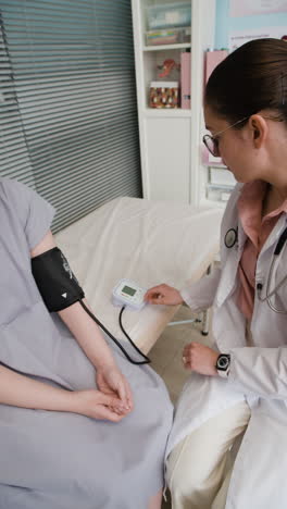 medical examination of a patient's blood pressure