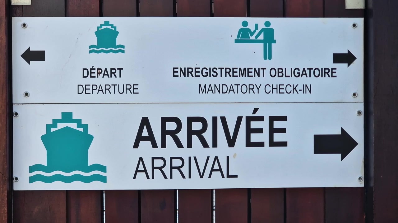 Ferry Terminal on Saint Barthelemy Island, Sign With Directions for Departure and Arrival, Close Up