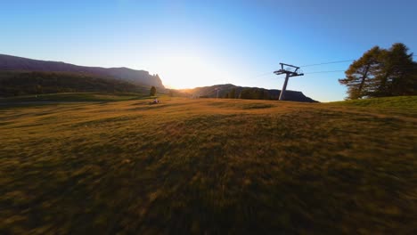 mountains, forest and fields filmed at alpe di siusi in european alps, italian dolomites filmed in vibrant colors at sunset