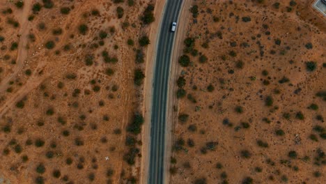 Top-view-of-cars-on-California-State-Route-62-at-Joshua-Tree-National-Park,-Mojave-Desert