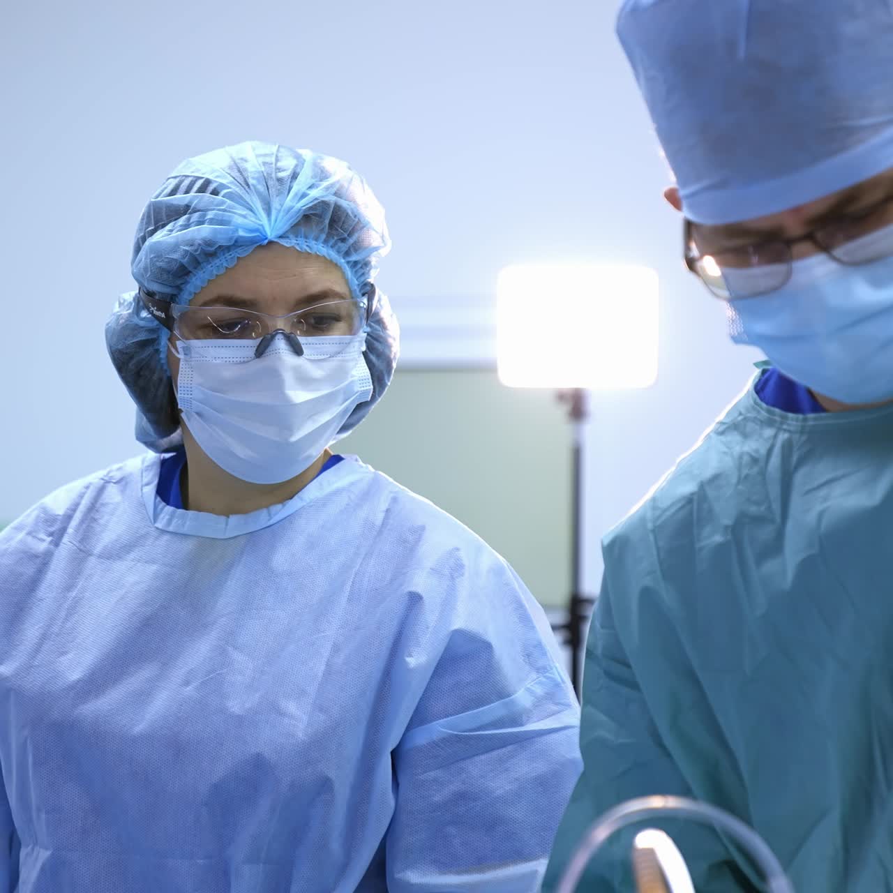 Medical team performing operation. Group of surgeon at work in operating theatre