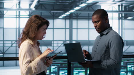 Server farm workers using devices to perform vulnerability scans