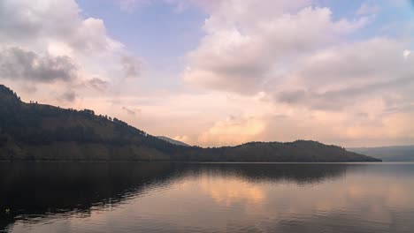 scenic lake view with hills and cloudy sky