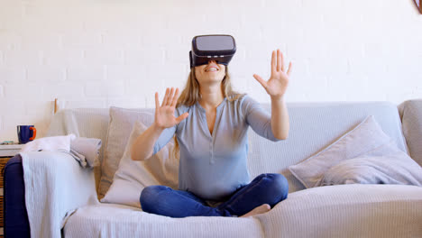 woman using virtual reality headset in living room 4k