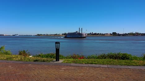 river boat cruising along the mississippi river in new orleans