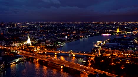 phra phuttha yodfa bridge, memorial bridge with buildings at chao phraya river. bangkok at sunset, thailand. 4k cityscape vdo