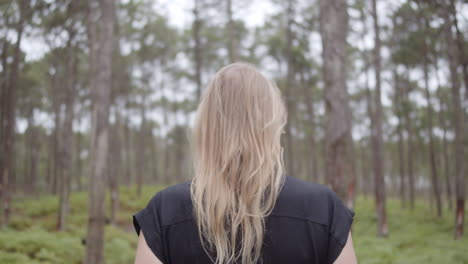 woman walking in a forest