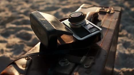 animation of do it for them over camera and suitcase on beach