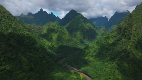 aerial view of lush green mountains and river valley