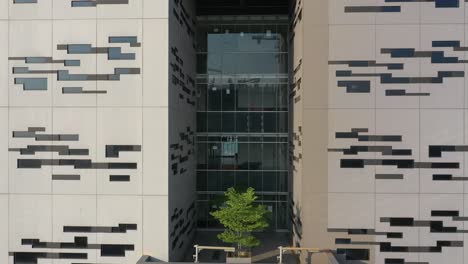 modern building facade with plants and geometric design