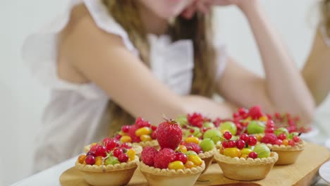family making fruit tarts